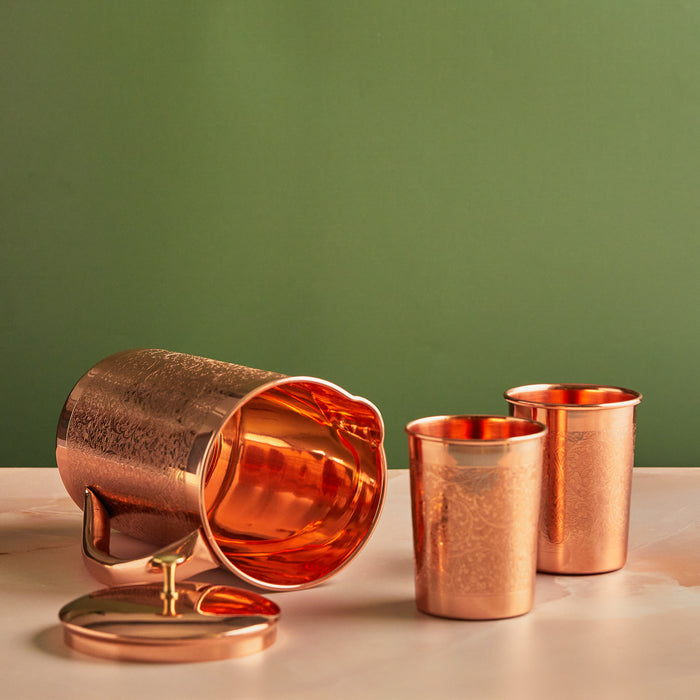 Copper jug set with two glasses showcasing features