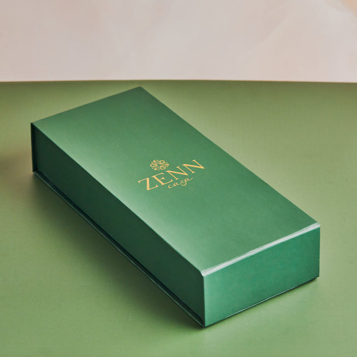 Green rectangular box labeled “ZENN” in gold lettering,