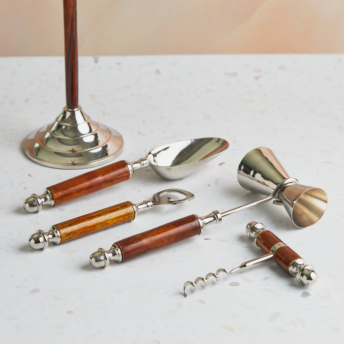 A set of elegant bar tools with wooden handles and shiny metal accents with dimension