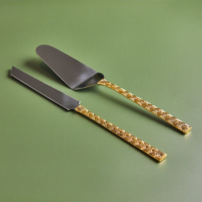 A 2-piece cake knife and server set with brass handles