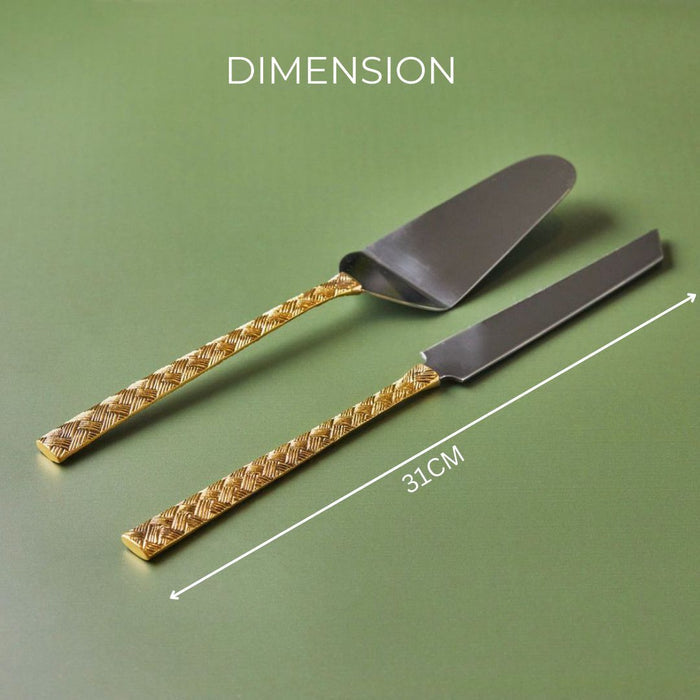 A 2-piece cake knife and server set with brass handles,